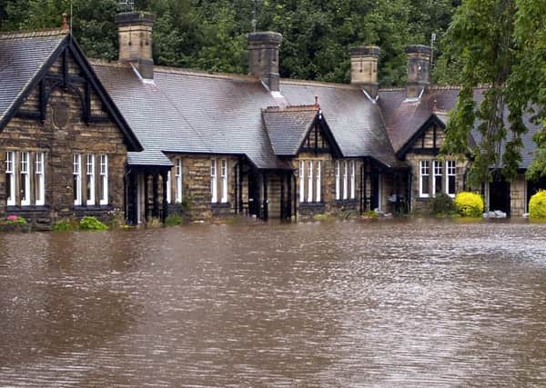 Armstrong Cottages at Rothbury, pictured during the 2008 flood.