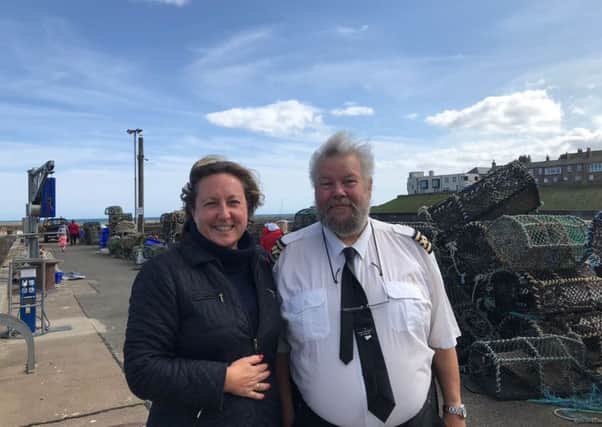 Berwick MP Anne-Marie Trevelyan with Seahouses harbourmaster Captain Phil Brabban.