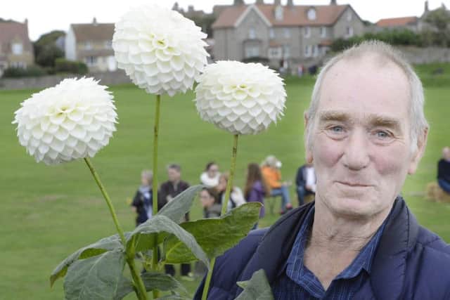 Jimmy Johnson, from Ellingham, with his winning dahlias. Picture by Jane Coltman