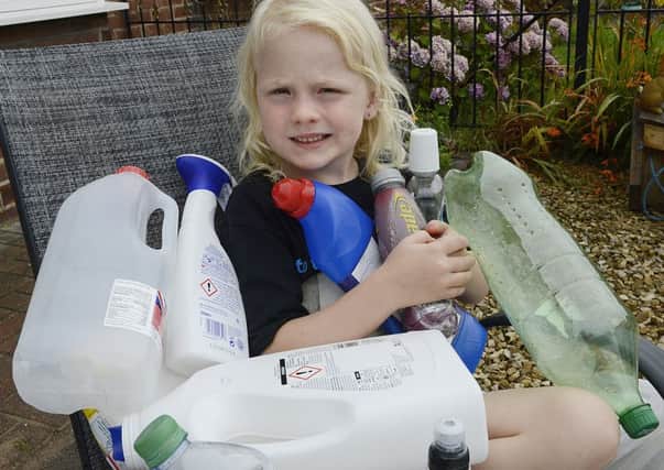 Rayer Fay Waddell, who has received a community award for her efforts, with some of the plastic items she has collected near her home in Bedlington. Picture by Jane Coltman.