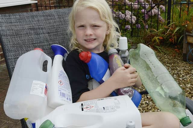 Rayer Fay Waddell, who has received a community award for her efforts, with some of the plastic items she has collected near her home in Bedlington. Picture by Jane Coltman.