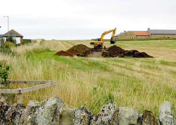 A digger at work on the site of the proposed development near Kings Field. Picture by Mike Hosken