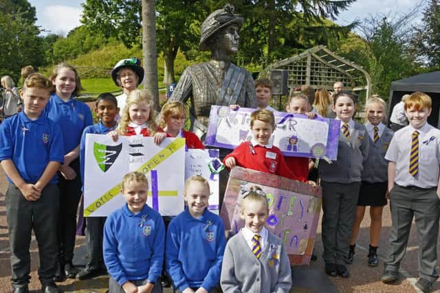 School pupils and Penni Blythe at the statue unveiling ceremony. Picture by Jane Coltman.