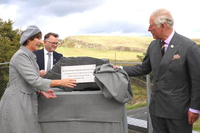 The Prince of Wales unveils a plaque at The Sill, helped by the Duchess of Northumberland and Tony Gates, chief executive of the Northumberland National Park Authority. Picture by Simon Williams, Crest Photography