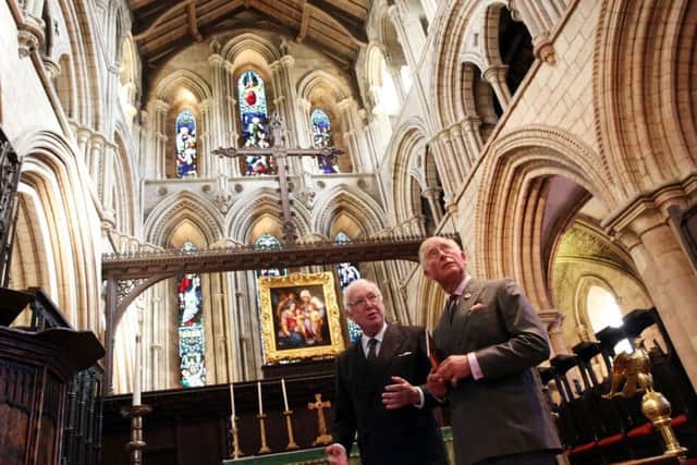 The Prince of Wales with Dr Tom Kelsey, from Hexham Abbey conservation team, in the abbeys chancel.