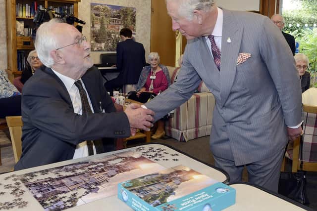 Prince Charles meets Maurice Frost in the Stuart Halbert drop-in centre at The Alnwick Garden. Picture by Jane Coltman