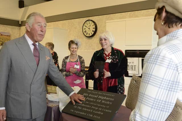 Prince Charles unveils a plaque in the Stuart Halbert drop-in centre. Picture by Jane Coltman