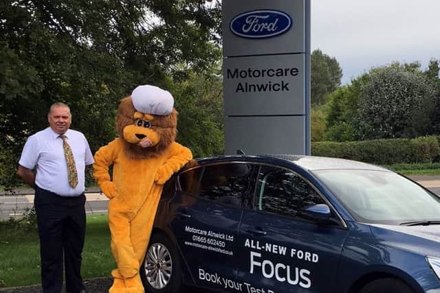 Alf, Alnwick Food Festival mascot, with Derek Oetting, from event sponsor Ford Motorcare.