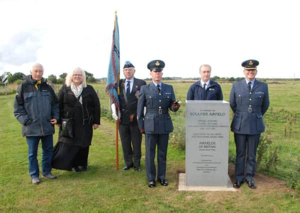 Director general of the Airfields of Britain Conservation Trust Kenneth Bannerman, Group Captain Kevin Cowieson, Station Commander of RAF Boulmer, and others at the unveiling of the memorial.