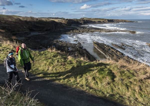 Surveying the Coast Path near Howick. Picture by Gavin Duthie