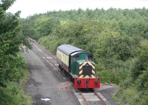 The carriage on the rails along the old trackbed. Picture by Pat Murphy