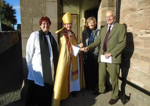 Rev Alison Hardy and Col Michael Craster welcome Bishop Christine to St Peter the Fisherman Church, Craster.