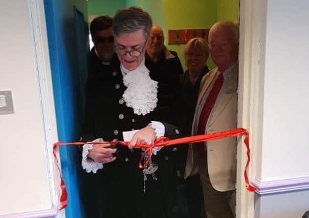 The High Sheriff of Northumberland, Michael Orde, cuts the ribbon on the new-look Amble Youth Project facilities.