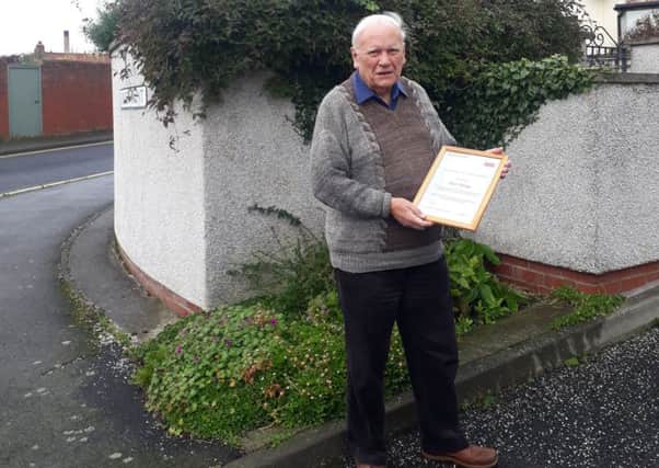 St Cuthberts Way founder Ron Shaw with the certificate.