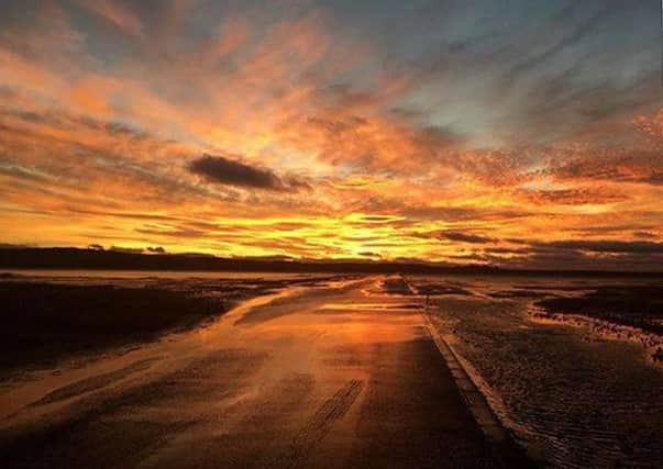 A fantastic fiery sky caught by Claire Ashby waiting for the tide to allow her access to Holy Island causeway. 275 Facebook likes