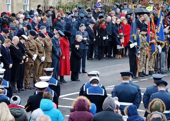Crowds gather at Alnwick war memorial on Remembrance Sunday last year. Picture by Steve Miller