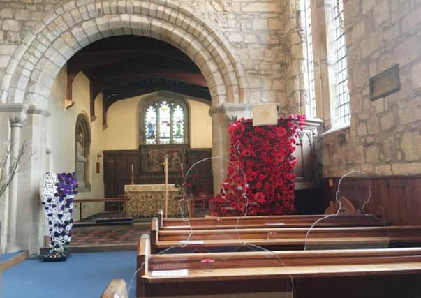 There But Not There silhouettes in the pews at St Mary's Church, Belford. Picture by Alan Hughes
