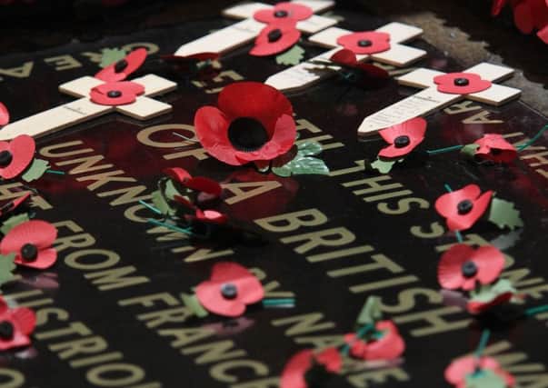 Poppies on the Tomb of the Unknown Warrior at Westminster Abbey. Picture by REX/Shutterstock (4240843c)