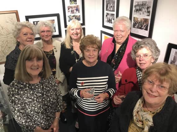 Representatives of the WIs marking their centenaries. Back row, from left: Janis Crook, president of Alnmouth WI; Jackie Wylie, archivist of the Northumberland Federation; Janet Holt, president of Longhoughton and Boulmer WI; Brenda Robertson, president of Eglingham WI; middle row:  exhibition co-ordinator Romaine Barclay-Kim; Jeanette Archbold, secretary of Howick WI; Christine Hutchinson, president of Bamburgh WI; and, front, Joan Little, president of Embleton WI. Members of Doddington WI were unable to make the open evening.