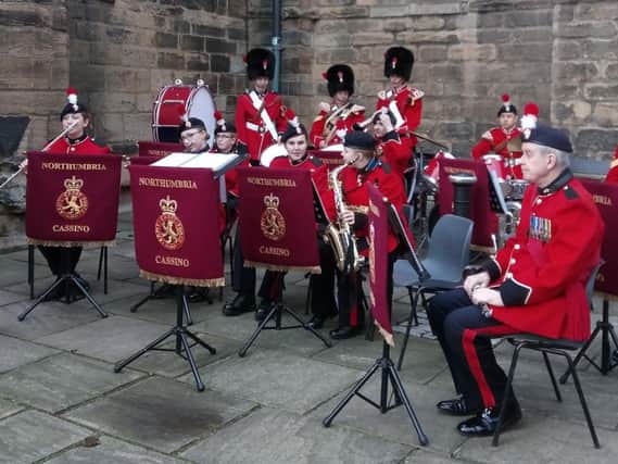 The Northumbria Army Cadet Force Cassino Band welcomes guests to the service at Hexham Abbey.