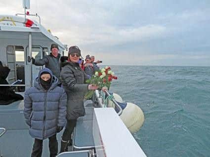 Able Seaman Postlethwaite's great-granddaughter Wendy Thompson about to spread flowers at the site of the sinking of HMS Ascot.
