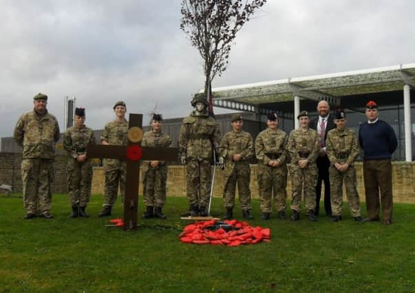 From left, WO2 Nick Tuckey, cadets Aimee Povey, Regan Povey, Mackenzie Hudspeth, Nicky Morton-Chisholm, Katie Bradley, Charlotte Lord and Jack Kadansky and Major Eyton Parker. Behind is the academy's Principal Director Secondary, Steve Gibson.