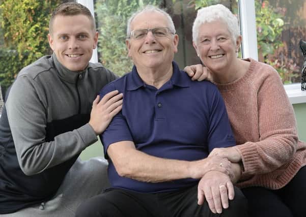 Brian Middleton recovering at his Ellington home with his wife Linda and his son Darren. Picture by Jane Coltman