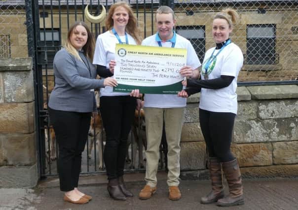 Left to right,  Lorna White, Robert McCarthy and Lisa Brown present a cheque for Â£2,792 to a representative from the Great North Air Ambulance Service.