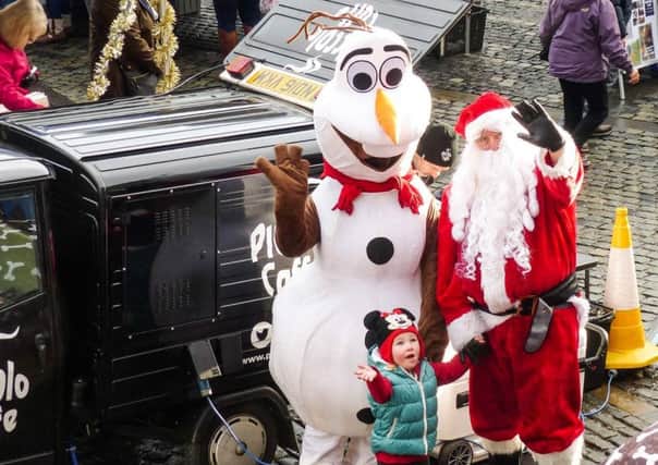 Santa and Olaf get ready for Small Business Saturday.