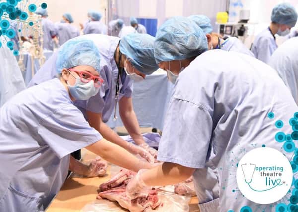 Student get to grips with a procedure during Operating Theatre Live at the Duchesss Community High School, Alnwick.