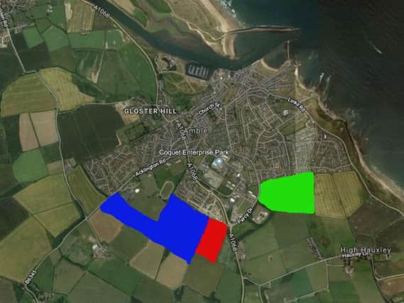 The sites in Amble for up to 500 homes (blue), up to 166 houses (red) and up to 272 (green).