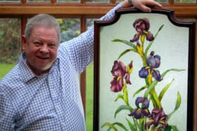 Neil Wilton with one of the pieces from his cloisonne collection.