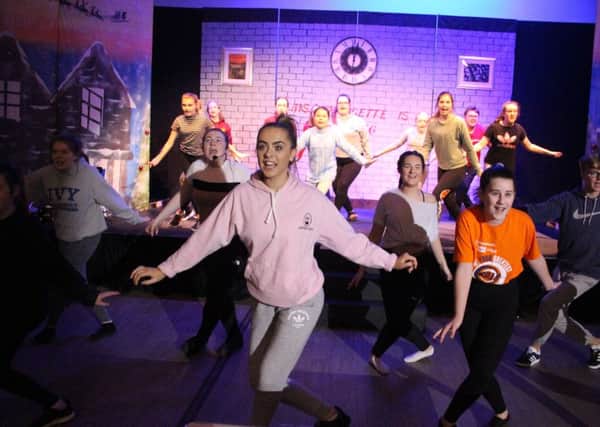 DHCS pupils rehearse for their Christmas show.