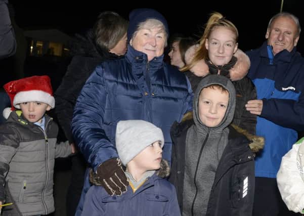 All smiles at the switch-on of Beadnell Christmas lights. Picture by Jane Coltman