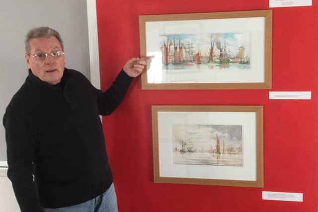 John Sturmey, curator of Steam at Shields, with two of his exhibition  paintings.