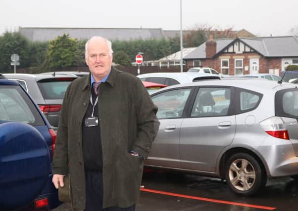Coun Richard Dodd at the extended car park in the area between Merton Way and Meadowfield following the completion of the works.