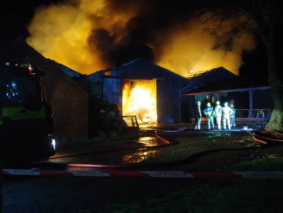 Firefighters at the scene of the devastating blaze at Whinney Hill Farm.
