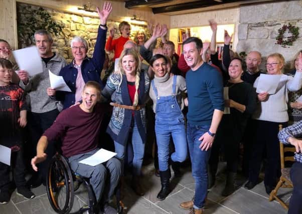 Countryfile presenters lead the Christmas party sing-song at the Bird in Bush at Elsdon.