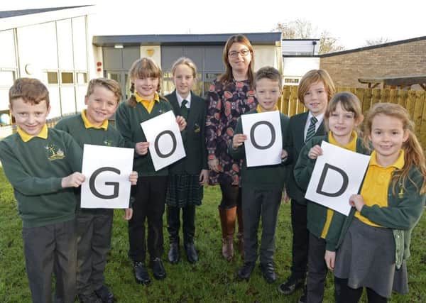 Warkworth Primary School pupils and headteacher Laura Ritson marking their Good rating from Ofsted. Picture by Jane Coltman