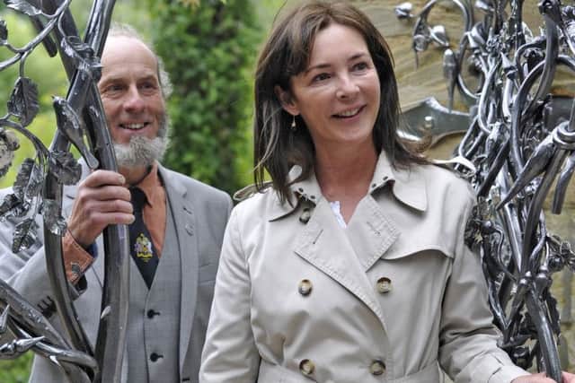 Blacksmith Stephen Lunn and the Duchess of Northumberland at the unveiling of the gates. Picture by Jane Coltman