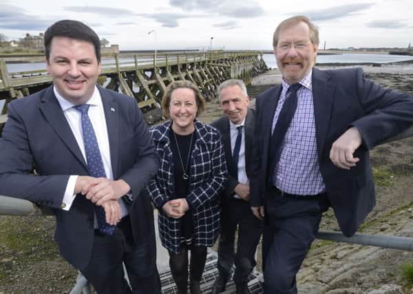 Coastal Communities Minister Andrew Percy at Tweed Dock which has received a  Â£2 million grant, with Anne-Marie Trevelyan MP, Alan Irving, chief executive of Berwick Harbour Commission and Andy Richardson, chairman of Berwick Harbour Commission.
 Picture by Jane Coltman