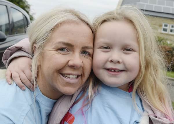 Cassie's daughter Ruby with her aunt Nadine at the memorial walk.  Picture by Jane Coltman