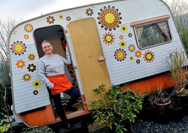 Nichola Lodge with one of Circa's vintage caravans in Amble.  Picture by Jane Coltman