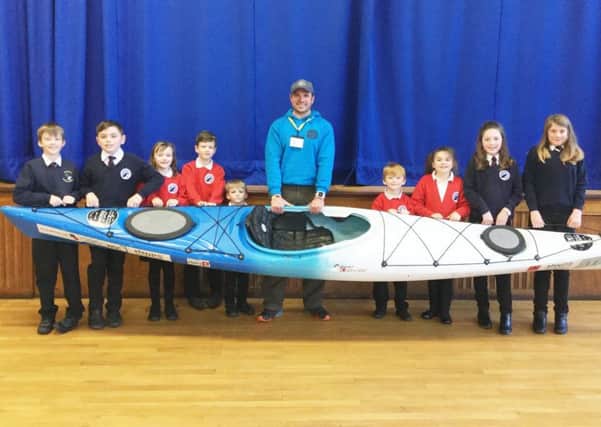 Dan Smith with pupils at Seahouses Primary School.