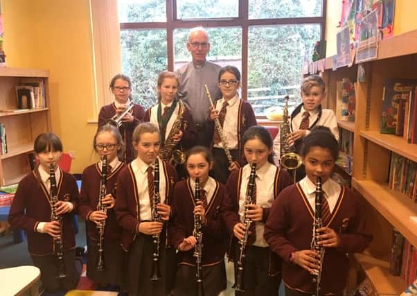 Whittingham's young musicians and  Reverend Ian Chadwick