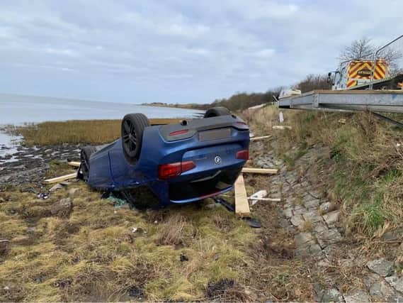 A car ended up on its roof after crashing at Budle Bay, near Bamburgh.