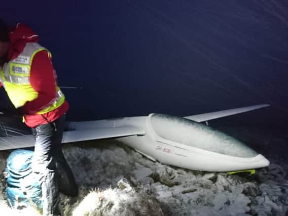 A rescuer at the scene of the glider crash on The Cheviot.