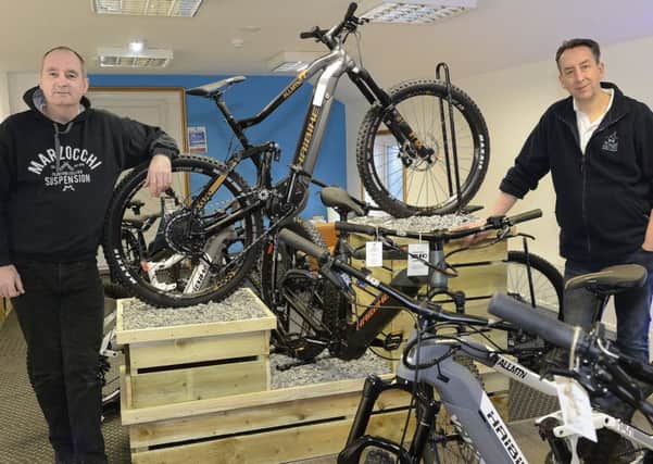 Ian Simpson, left, and Peter Bredael in the Morpeth Electric Bicycle Companys showroom.  Picture by Jane Coltman