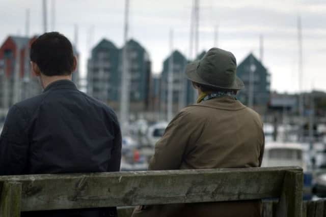 Kenny Doughty (DS Aiden Healy) and Brenda Blethyn (DCI Vera Stanhope) looking across the marina to the Coble Quay apartments (Episode 2, Series 9).