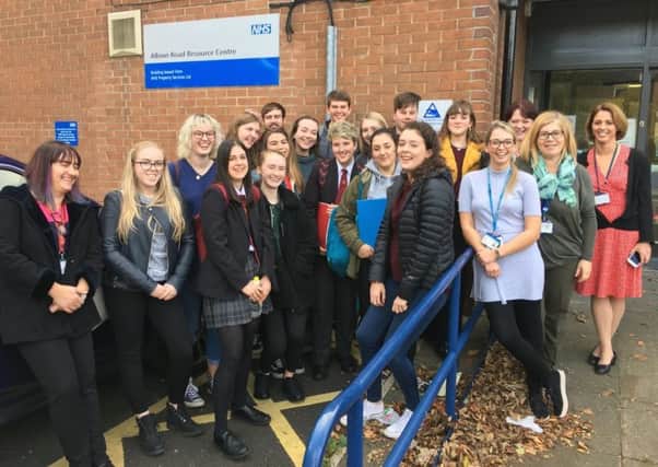 Students from St Thomas More RC Academy with staff at the clinic which is going to be made more young people friendly thanks to a partnership with Northumbria Healthcare NHS Foundation Trust and Tyne & Wear Citizens.
